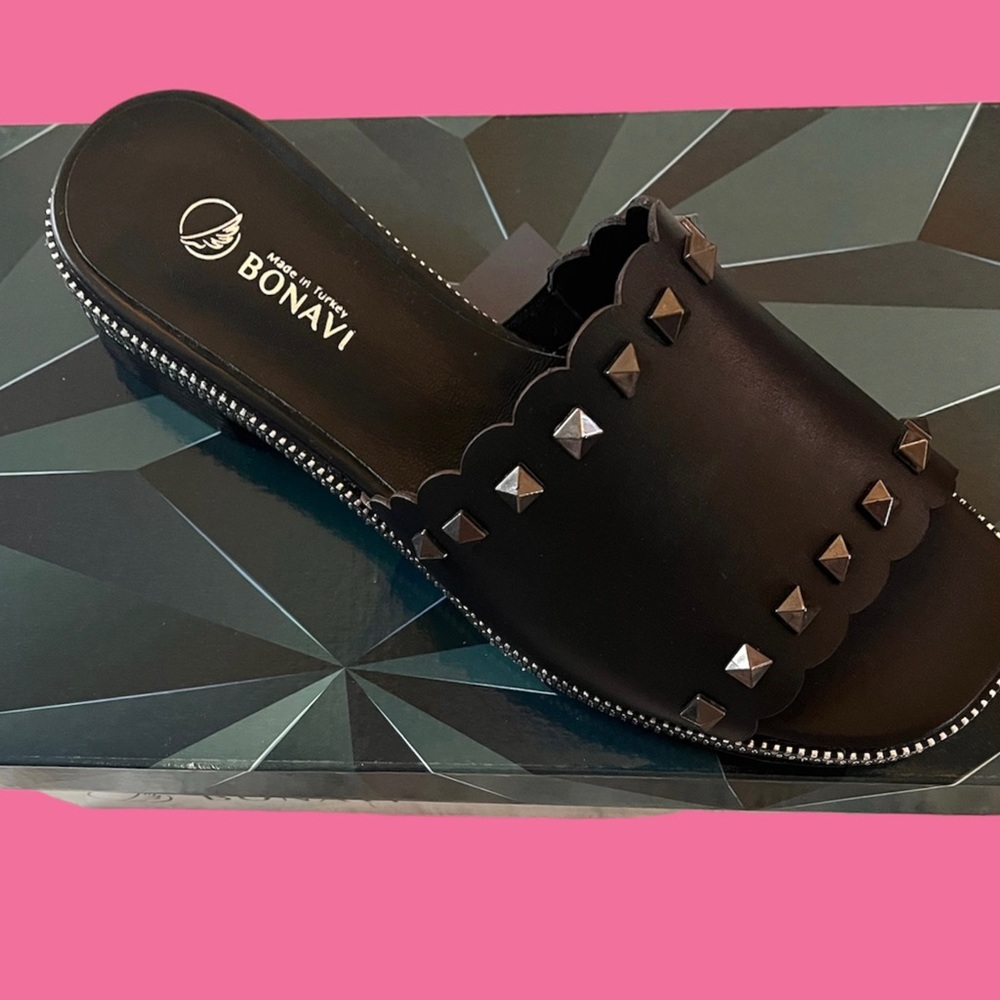 Bonavi black slide sandal with studs.